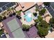 A detailed aerial view showcases the pool, hot tub, tennis court, and basketball court amenities at 9357 Golden Timber Ln, Las Vegas, NV 89117
