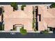 Aerial view of homes with terracotta tile roofs and lush green landscaping, showcasing community layout at 9357 Golden Timber Ln, Las Vegas, NV 89117