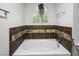 Bathroom with a white soaker tub at 9357 Golden Timber Ln, Las Vegas, NV 89117