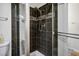 Bathroom featuring a shower with a glass door at 9357 Golden Timber Ln, Las Vegas, NV 89117
