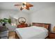 Bedroom featuring hardwood floors, fan, with ample natural light at 9357 Golden Timber Ln, Las Vegas, NV 89117