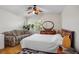 Bright bedroom with hardwood floors, fan, seating area, and ample natural light at 9357 Golden Timber Ln, Las Vegas, NV 89117