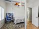 Cozy bedroom featuring natural light, ceiling fan, and workspace at 9357 Golden Timber Ln, Las Vegas, NV 89117
