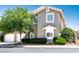 Charming two-story home with a well-maintained front yard and lush greenery at 9357 Golden Timber Ln, Las Vegas, NV 89117