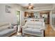 Bright living room featuring hardwood floors that flow into dining space at 9357 Golden Timber Ln, Las Vegas, NV 89117