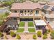 Aerial view of backyard featuring covered outdoor seating, landscaping, a patio, and a fire pit at , Las Vegas, NV 89149