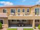 Exterior of home featuring a second story patio, a back patio, green turf, and covered seating at , Las Vegas, NV 89149