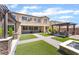 Spacious backyard featuring well-manicured artificial grass and an outdoor dining space at , Las Vegas, NV 89149