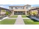 Backyard with artificial grass, an outdoor kitchen, and dining area perfect for outdoor gatherings at , Las Vegas, NV 89149