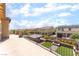 Wide backyard view showing manicured landscaping, fire pit, and pool at , Las Vegas, NV 89149
