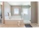 Bright bathroom featuring a soaking tub and separate glass-enclosed shower at , Las Vegas, NV 89149