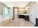 Bright Primary bathroom with a soaking tub, glass enclosed shower, and dual vanity sinks at , Las Vegas, NV 89149