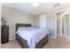 Bedroom featuring carpet, a bed with storage, and access to the hallway at , Las Vegas, NV 89149
