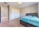 Comfortable bedroom featuring carpeted floor, closet, and a cozy blue duvet on the bed at , Las Vegas, NV 89149