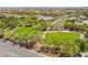 Beautiful community park featuring lush green spaces, mature trees, walking paths, and shaded seating areas for relaxation at , Las Vegas, NV 89149