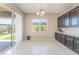 Bright dining area with sliding glass doors to the patio, adjacent to a kitchen area with ample cabinets at , Las Vegas, NV 89149
