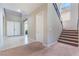 Inviting entryway featuring a staircase, neutral walls, and views into other rooms at , Las Vegas, NV 89149