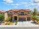 Beautiful two-story home featuring a tile roof, balcony, three-car garage and well-manicured landscaping at , Las Vegas, NV 89149