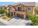 Lovely two-story home featuring a tile roof, balcony, three-car garage and mature landscaping at , Las Vegas, NV 89149