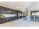 Well-appointed kitchen with stainless steel appliances, granite counters, mosaic backsplash, and ample cabinet space at , Las Vegas, NV 89149