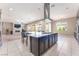 Bright, open kitchen with a large center island, stainless steel appliances, and living room view at , Las Vegas, NV 89149
