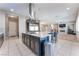 Open-concept kitchen featuring stainless steel appliances, center island, and open views of the living room at , Las Vegas, NV 89149