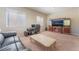 Comfortable office space features a leather couch, desk, and ample lighting at , Las Vegas, NV 89149
