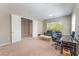 Versatile office space with natural light, a comfortable seating area, and a functional desk setup at , Las Vegas, NV 89149