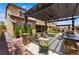 Outdoor kitchen and patio with a pergola, stone accents, and built-in grill, perfect for entertaining at , Las Vegas, NV 89149