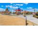 Gathering-friendly playground area with vibrant shade structures and well-maintained landscaping in a welcoming community at , Las Vegas, NV 89149