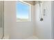 A modern shower with a window letting in natural light at , Las Vegas, NV 89149
