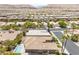 Elevated view of a tranquil community with stunning mountain views in the background at 10331 Rio De Thule Ln, Las Vegas, NV 89135
