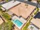 Aerial view of the backyard featuring a sparkling blue private pool and covered patio at 10331 Rio De Thule Ln, Las Vegas, NV 89135
