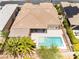 A backyard showcasing a sparkling pool, patio area, mature landscaping, and a pergola covered patio at 10331 Rio De Thule Ln, Las Vegas, NV 89135