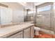 Bathroom features a walk-in shower with glass door, updated fixtures, and single vanity at 10331 Rio De Thule Ln, Las Vegas, NV 89135