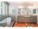 Spacious bathroom with double vanity, soaking tub, and separate glass enclosed shower at 10331 Rio De Thule Ln, Las Vegas, NV 89135