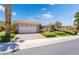 Inviting home with a wide driveway, spacious two-car garage and manicured landscaping at 10331 Rio De Thule Ln, Las Vegas, NV 89135