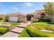 Inviting single story home with manicured lawn and beautiful brick pathway leading to front door at 10331 Rio De Thule Ln, Las Vegas, NV 89135