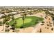 Lush green golf course with palm trees and desert landscaping creating a beautiful and challenging playing field at 10331 Rio De Thule Ln, Las Vegas, NV 89135