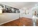 Open layout living room with beautiful hard wood floors and modern decor at 10331 Rio De Thule Ln, Las Vegas, NV 89135