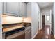 This home features a wet bar and sleek black counters at 10331 Rio De Thule Ln, Las Vegas, NV 89135
