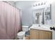 Bathroom with vanity, a shower with a pink curtain, and standard toilet for all essential needs at 109 Breezy Tree Ct # 202, Las Vegas, NV 89145