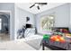 This cozy bedroom offers natural light, light blue walls, tile flooring, and is ready for new owners at 109 Breezy Tree Ct # 202, Las Vegas, NV 89145