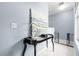 Upstairs hall featuring light blue walls, white tile floors, and black table at 109 Breezy Tree Ct # 202, Las Vegas, NV 89145