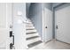 Hall with staircase leading upstairs, featuring white risers and grey carpeted treads at 109 Breezy Tree Ct # 202, Las Vegas, NV 89145