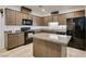 Kitchen features granite countertops, a central island, and modern appliances at 1200 Mission View Ct, Henderson, NV 89002