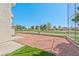 Spacious backyard featuring low maintenance landscaping, a walking path, and views of green space at 1201 Bourbon St, Pahrump, NV 89048