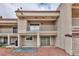 Backyard view of a two-story home with second-floor balcony, offering outdoor space at 1201 Bourbon St, Pahrump, NV 89048