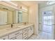 Bathroom featuring double sinks and a large mirror at 1201 Bourbon St, Pahrump, NV 89048