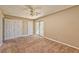 Spacious bedroom featuring neutral paint, carpet, and sliding glass door at 1201 Bourbon St, Pahrump, NV 89048